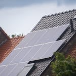 Solar panels installed on a residential rooftop, showcasing eco-friendly renewable energy solutions.